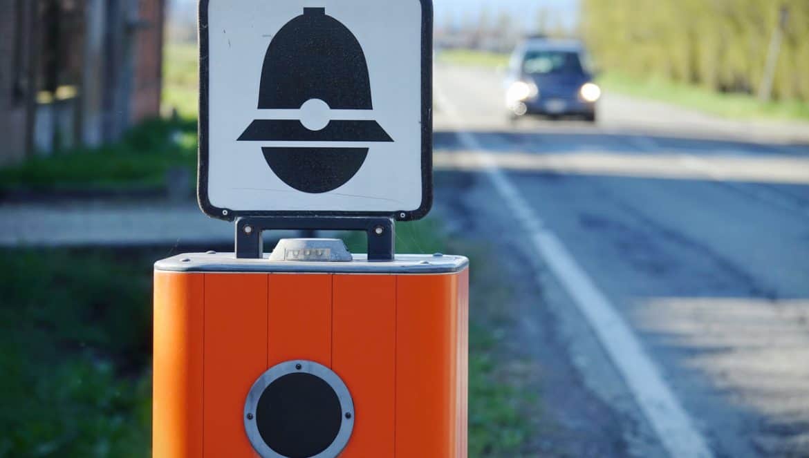 Traffic Enforcement Camera with TEXT that means electronic speed control in italian language and symbol of police