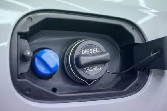 Tank filler neck for AdBlue and Diesel fuel close-up. Adblue diesel exhaust fluid fuel tank cap. Close up Adblue Diesel exhaust fluid DEF and fuel tank cap.