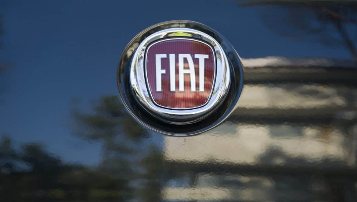 "Padua, Italy - July 9, 2011: Fiat metallic logo on a car rear hood. Fiat Automobiles S.P.A. is an Italian automaker which produces Fiat branded cars since 1899. Shot in a public parking."