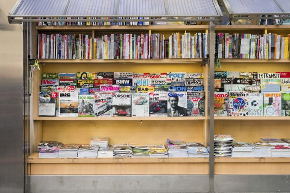 A large selection of magazine titles on display outside a kiosk in Tokyo, Japan.