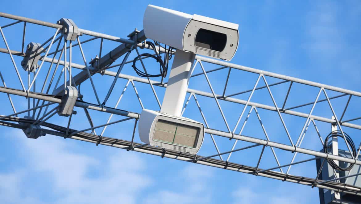 Traffic enforcement camera closeup photo over blue sky