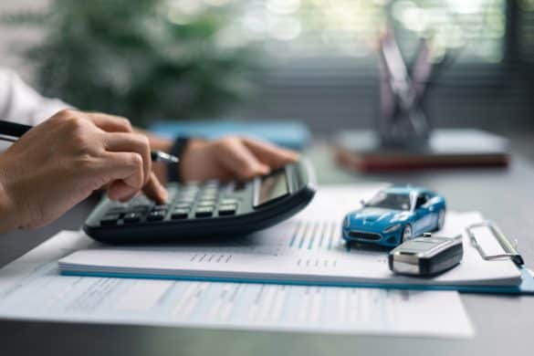 Finance bank tax expense accounting budget money businessman hand use Financial calculate accountant close up calculator with graph chart write office desk Business expense analysis saving home car
