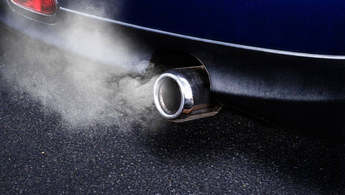 Exhaust pipe emits exhaust gases
sport exhaust pipe blue car