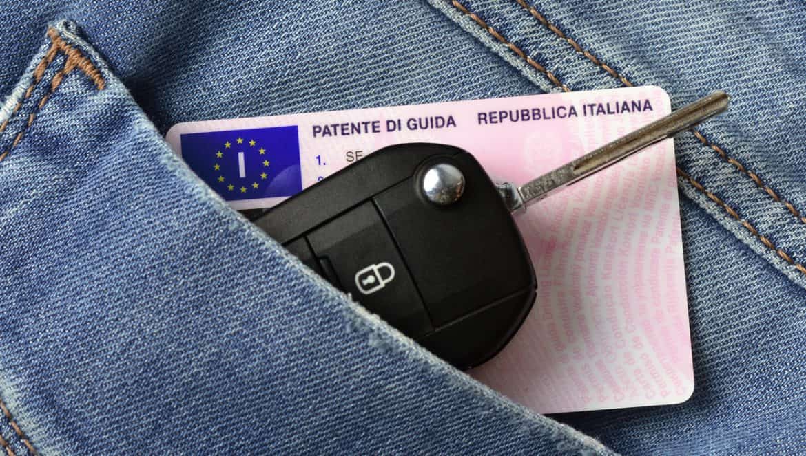 Car key and italian driving license in jeans pocket
