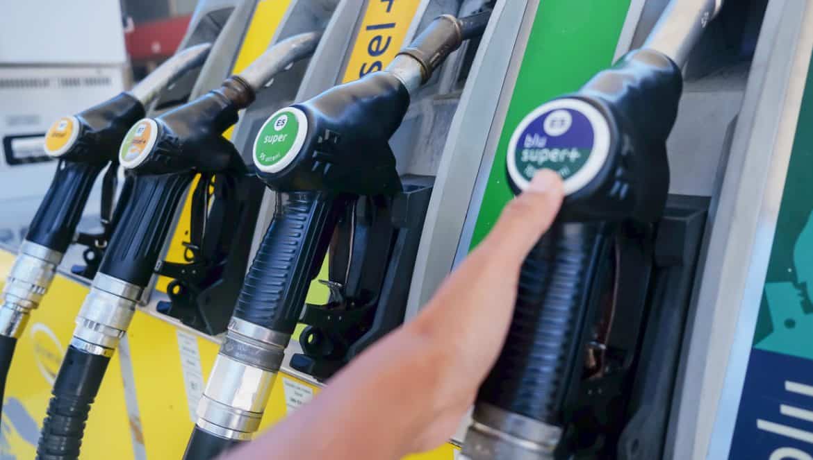 Mühlbach,Italy, August 18, 2019 - Close up shot of Asian customer holding a diesel fuel pump handle at gas station to refueling her vehicle, during Coronavirus pandemic